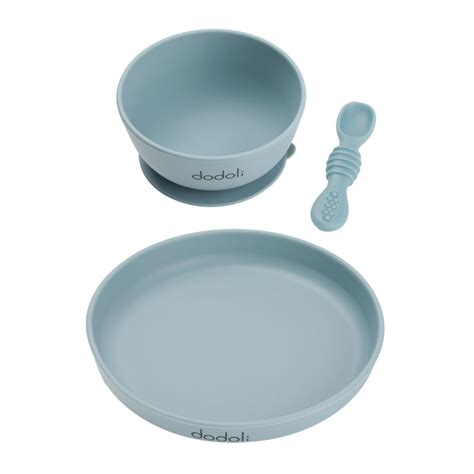 Fotografie cu un set de diversificare Dodoli: bol cu ventuză, linguriță moale și bavetă.