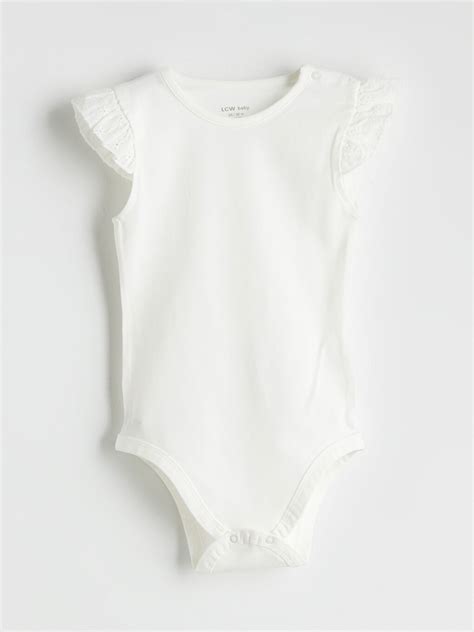 Bebeluș fericit purtând un body alb și pantaloni călduroși